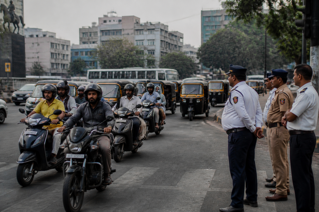 Pune bike taxis and auto-rickshaws on a city road amid transport regulation concerns