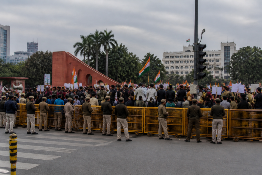 Jantar Mantar protests in Delhi with demonstrators and police near the designated protest site