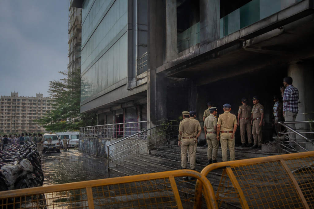 Surat arson threat investigation near an urban commercial complex with police presence