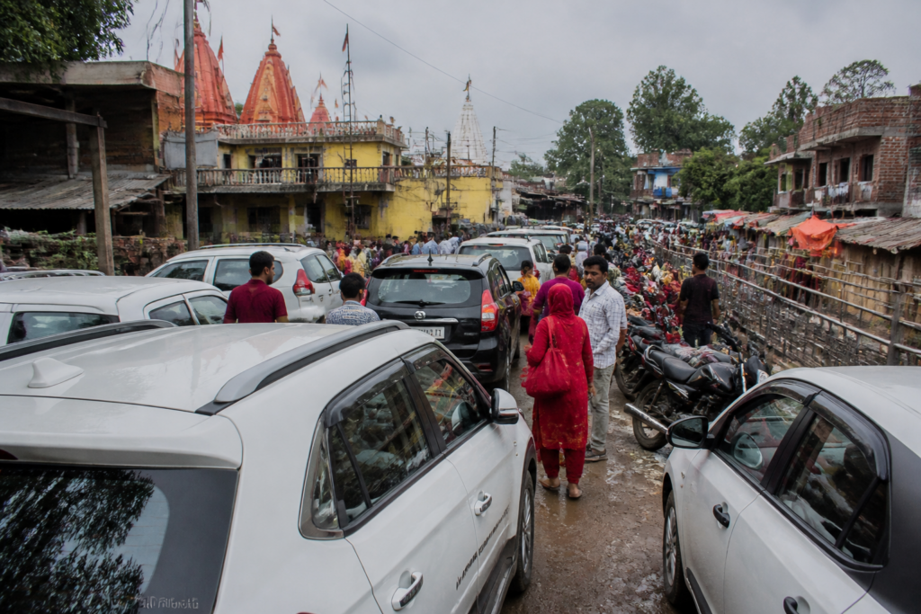 Traffic and roadside parking near the Kalka temple during a busy pilgrimage period