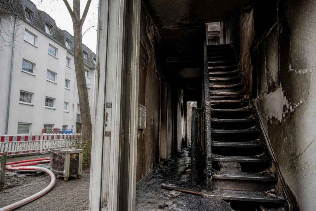 Germany apartment fire scene with a damaged staircase in a Bochum residential building