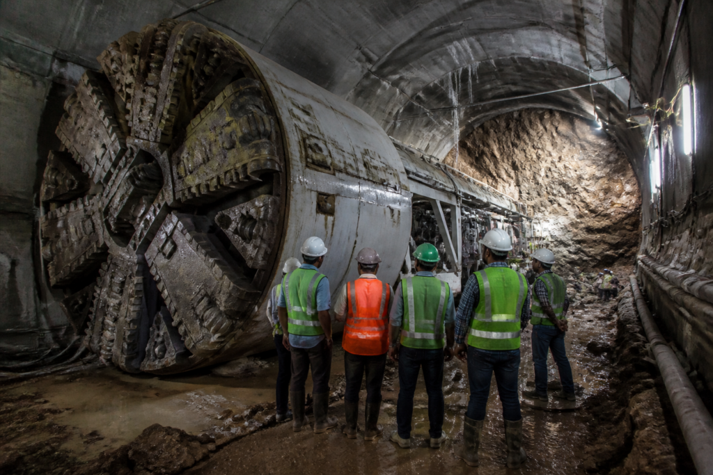 Bengaluru Pink Line metro construction tunnel with workers clearing underground obstructions