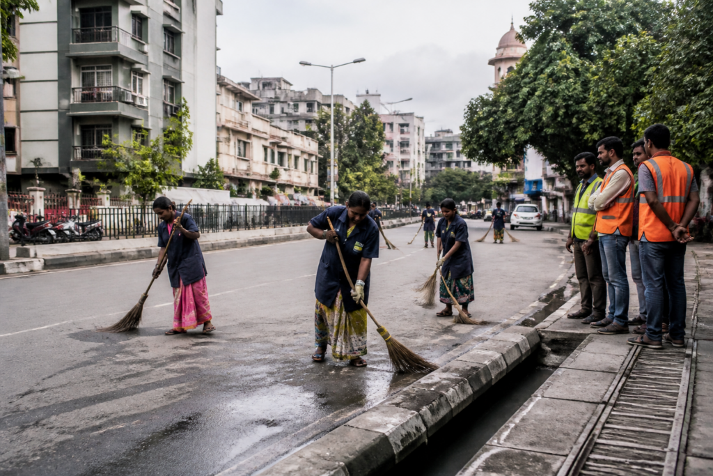 Pune cleaning contract under inquiry as municipal workers sweep a city road