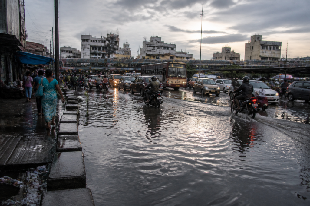 Erode rainfall leaves water stagnated on a city road near commercial areas