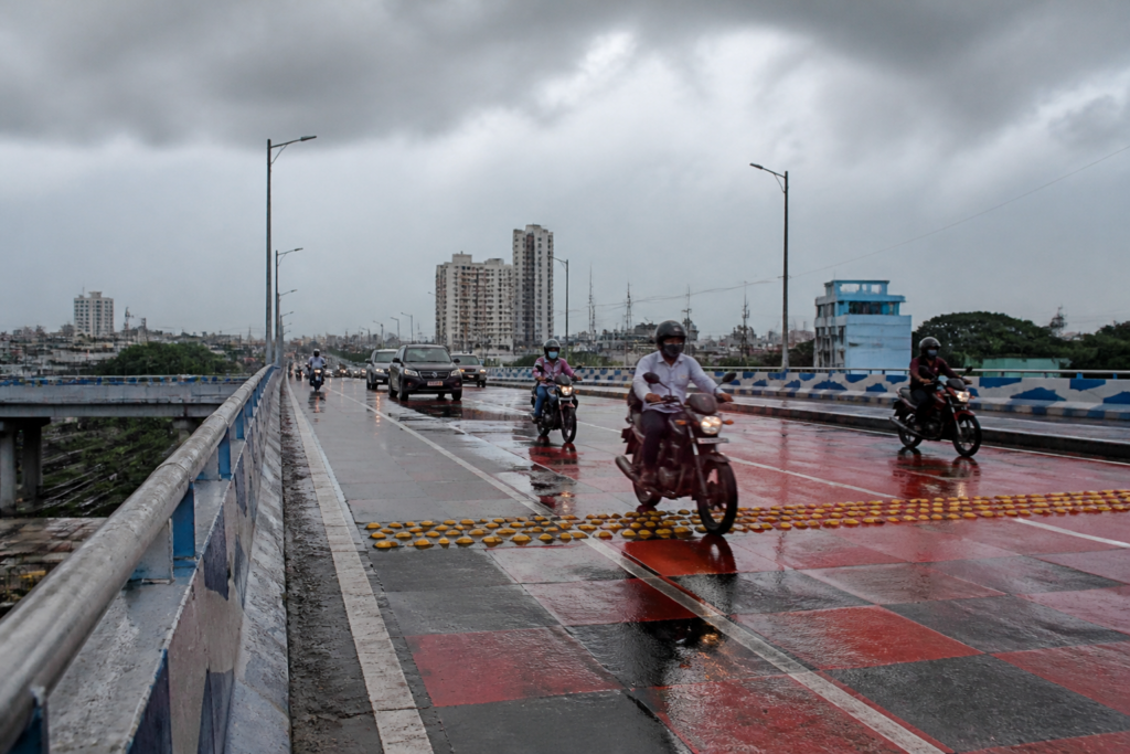 Anti-skid paint on a Kolkata flyover after motorcycle skidding incidents at Chingrighata.