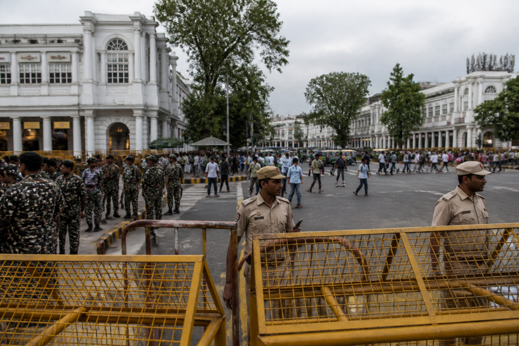 Delhi Tiranga march security barricades installed around Connaught Place before a planned protest.