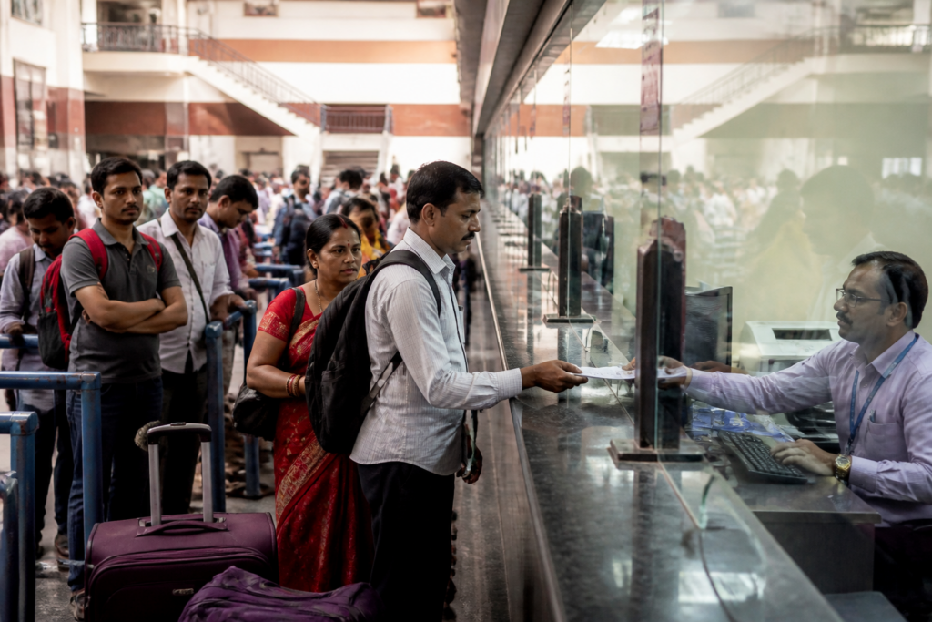 Railway counter ticket insurance for passengers at an Indian railway reservation counter