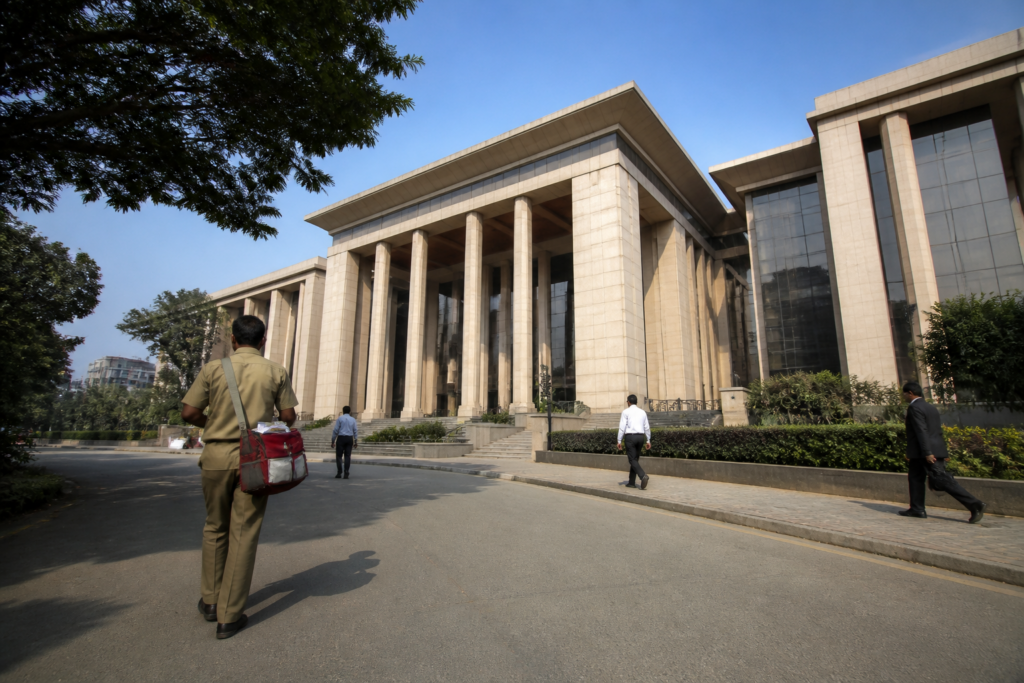 Karnataka High Court order directing the postal department to release a worker’s withheld salary
