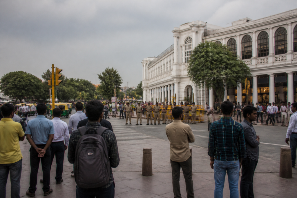 Connaught Place protests near Central Park affecting businesses and pedestrians in New Delhi