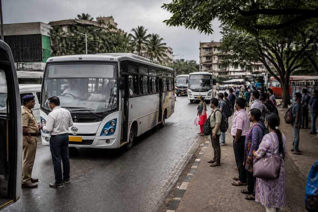 Kerala private bus operators' buses waiting at a busy city bus stop