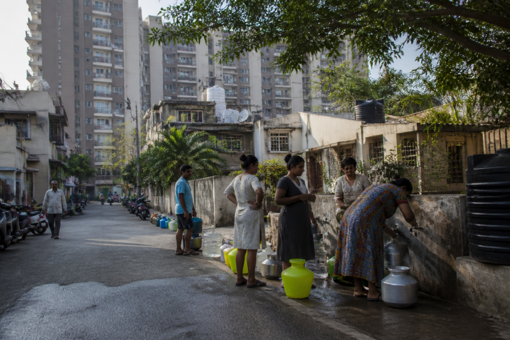 Pune water supply pipes and residential buildings during a municipal water disruption