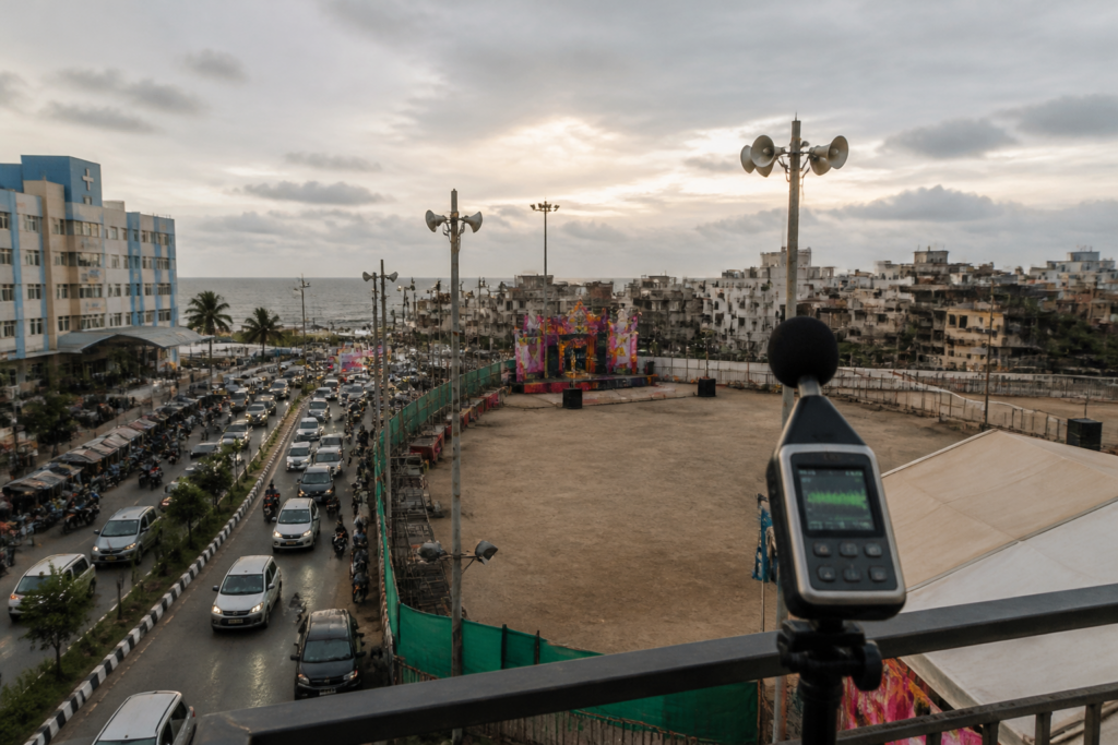 Veraval silent zone near a Garba venue, with a hospital and urban roads in the background