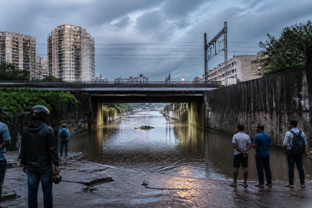 Panathur railway underbridge flooding with a cab surrounded by rainwater in Bengaluru