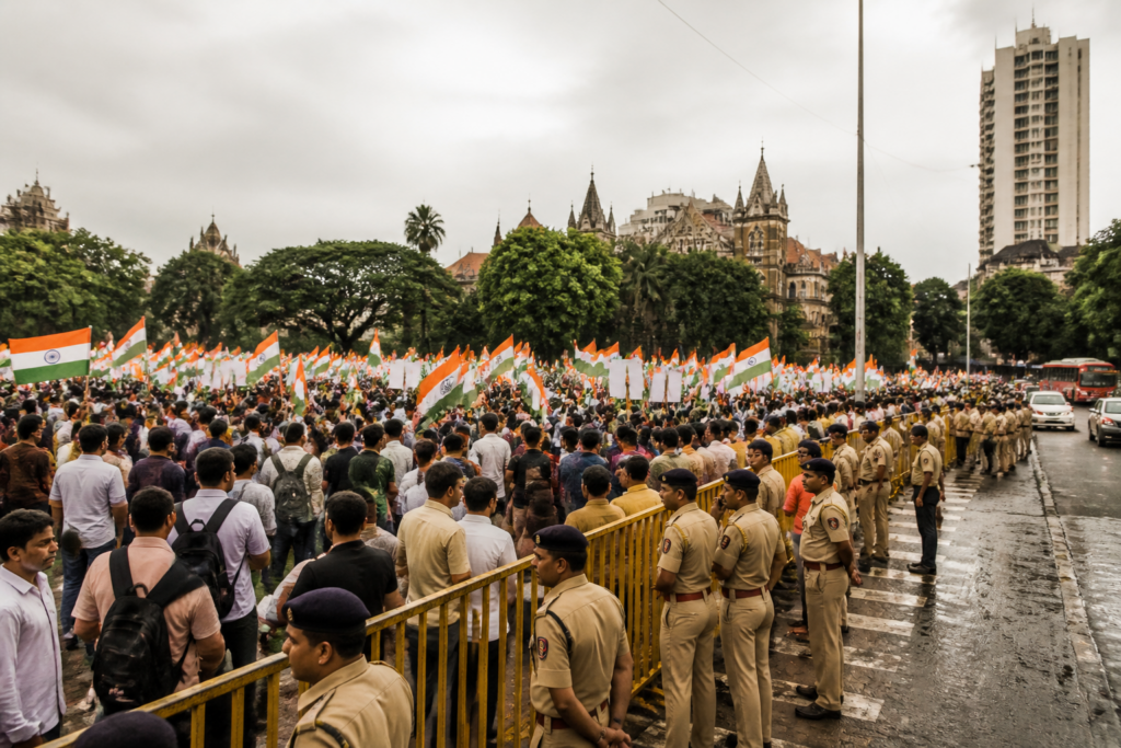 Mumbai protest at Azad Maidan with demonstrators holding the National Flag