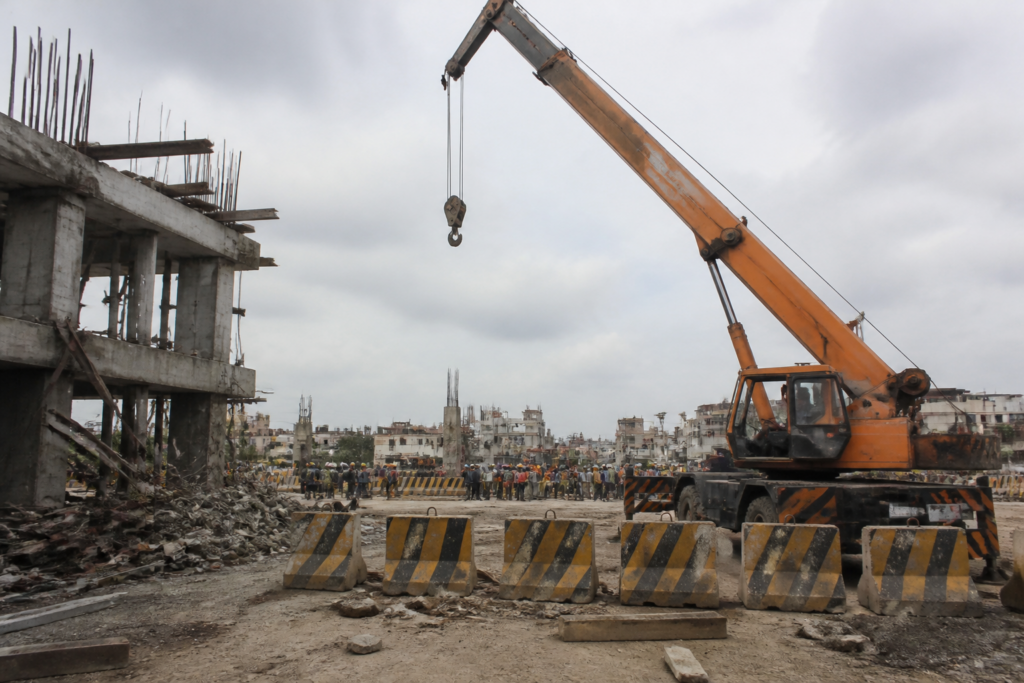 Hydraulic crane at a construction site in Guntur linked to a fatal migrant worker accident