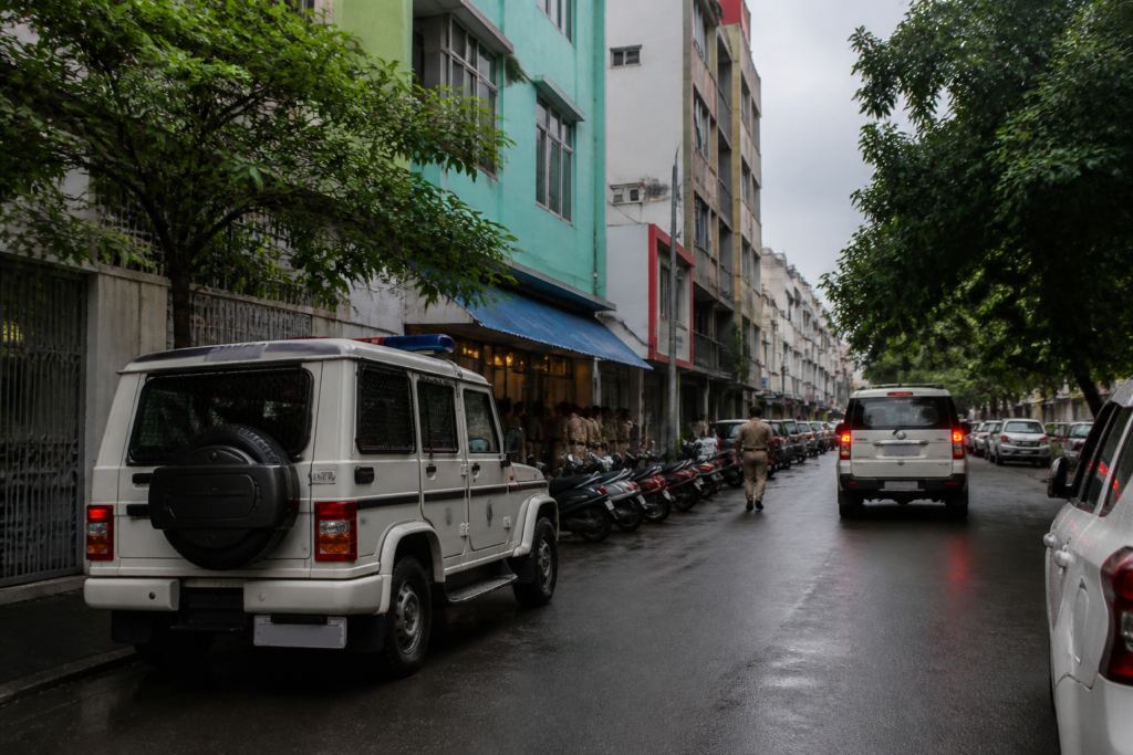 Puducherry POCSO case represented by a police vehicle outside a hotel district