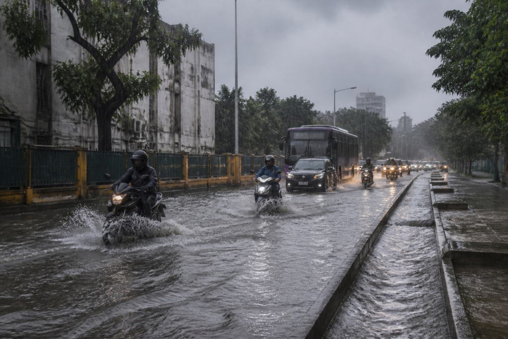 Tamil Nadu rain flooding a road near Coimbatore with commuters and waterlogged streets