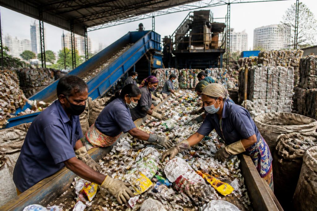 Mumbai waste management workers sorting recyclable material at a dry waste centre