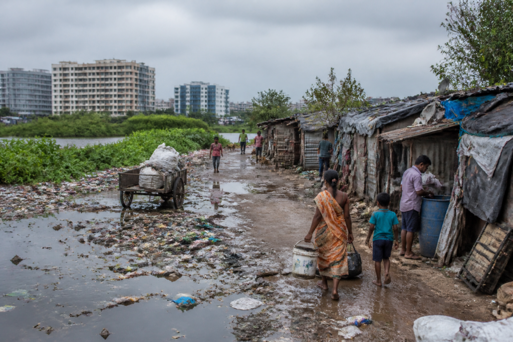 Whitefield sanitation crisis at an informal settlement with stagnant water and uncollected waste