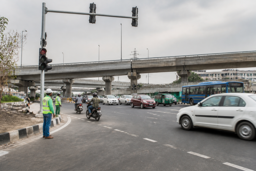 Barapullah Phase 3 traffic signals being installed near a congested Delhi road merging point