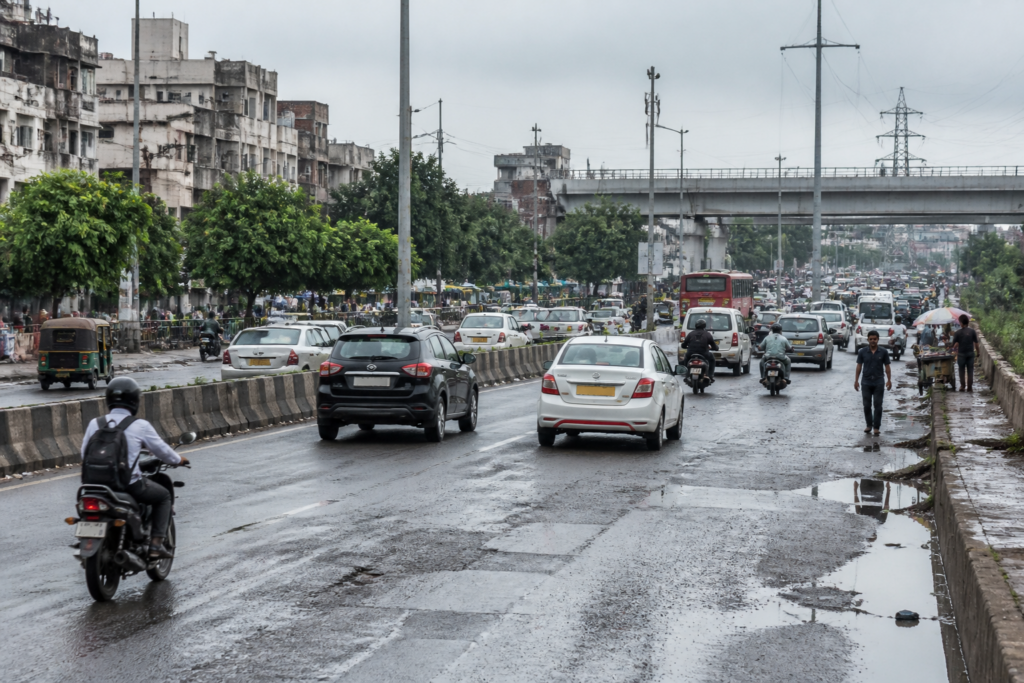 Mathura Road Delhi corridor showing lanes, traffic and roadside infrastructure near a busy junction
