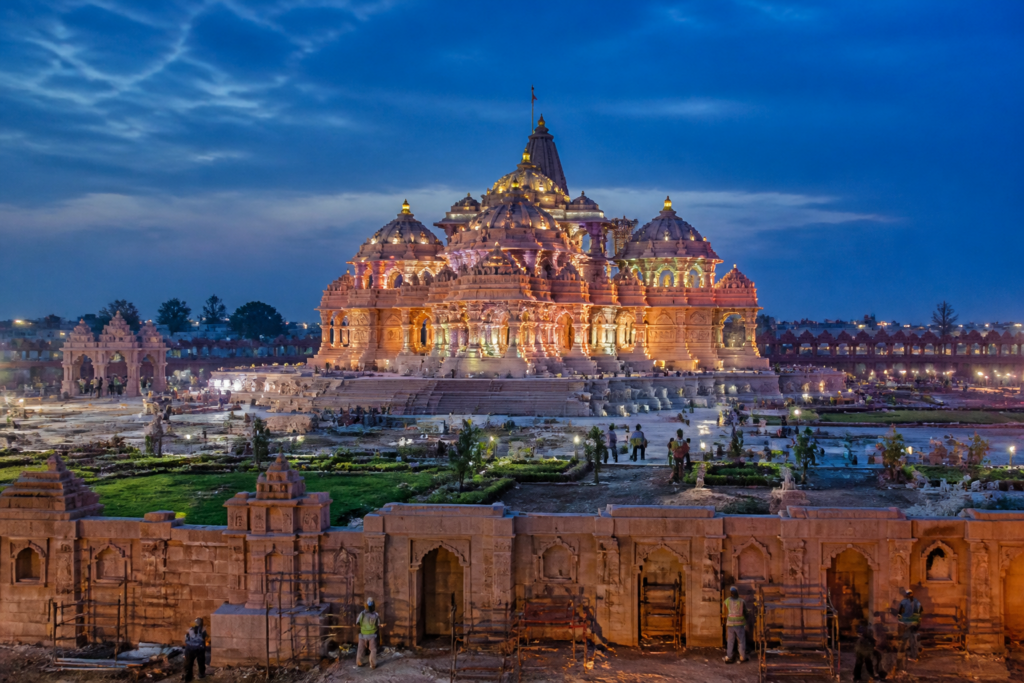 Ayodhya Ram temple complex with illuminated facade and surrounding parkota under construction