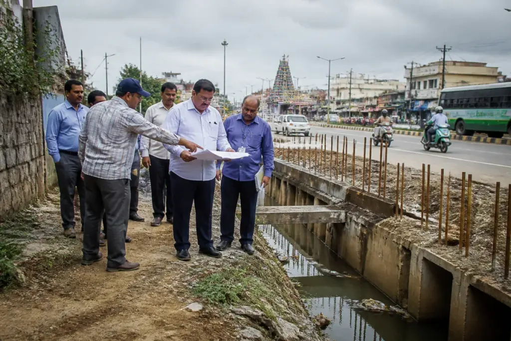 Medchal drainage works near a bus stop inspected by a municipal commissioner