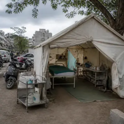 Illegal clinics in Pune represented by a roadside treatment tent near an urban neighbourhood