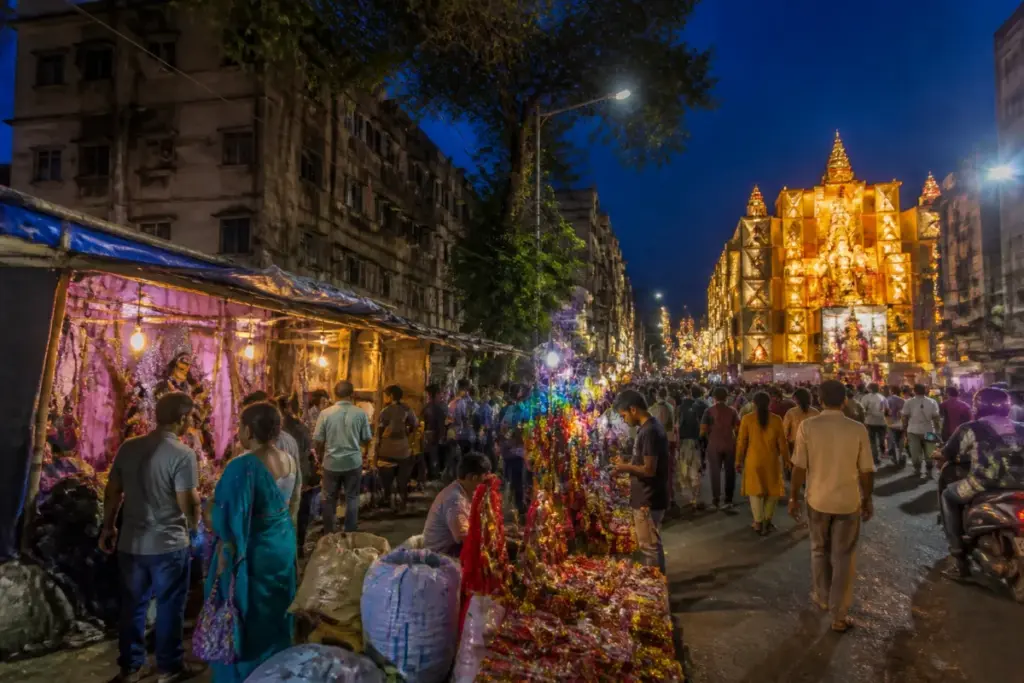 Durga Puja economy in Bengal, with a neighbourhood pandal and nearby small traders