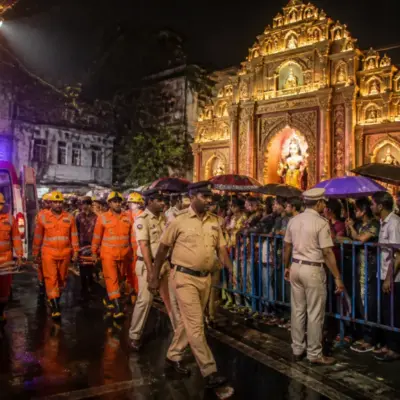 Kolkata Durga Puja crowd incident near a crowded pandal with emergency responders