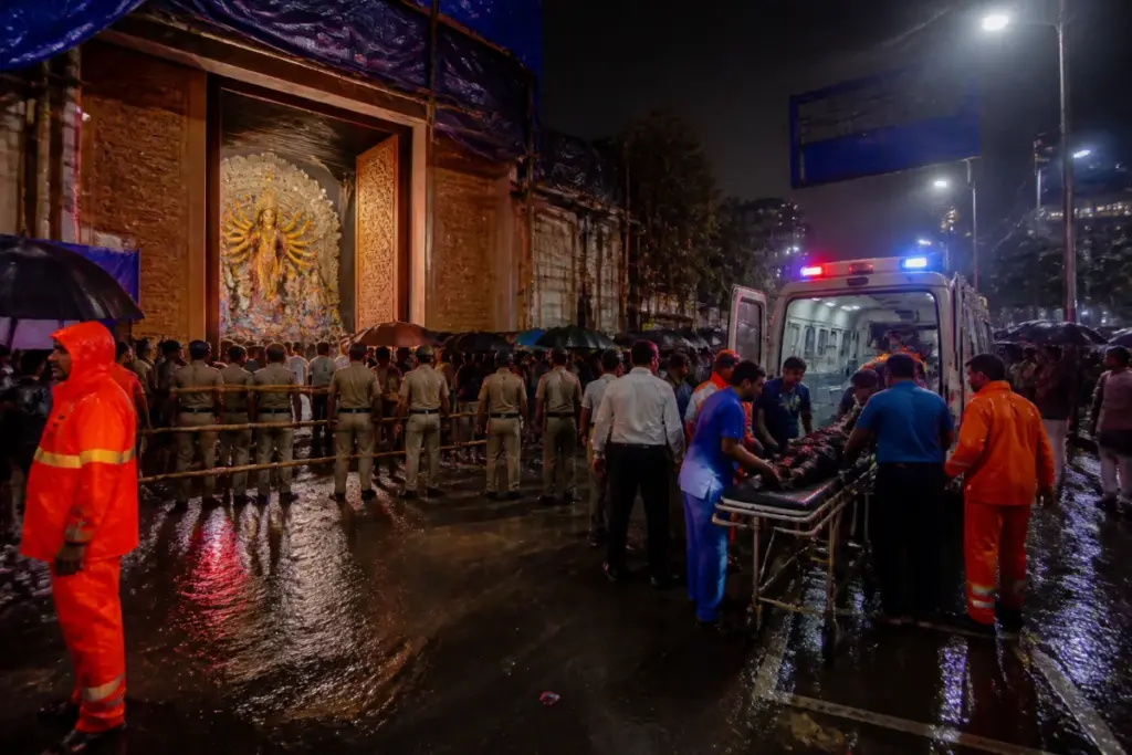 Emergency response outside the Kolkata puja pandal after a deadly crowd surge