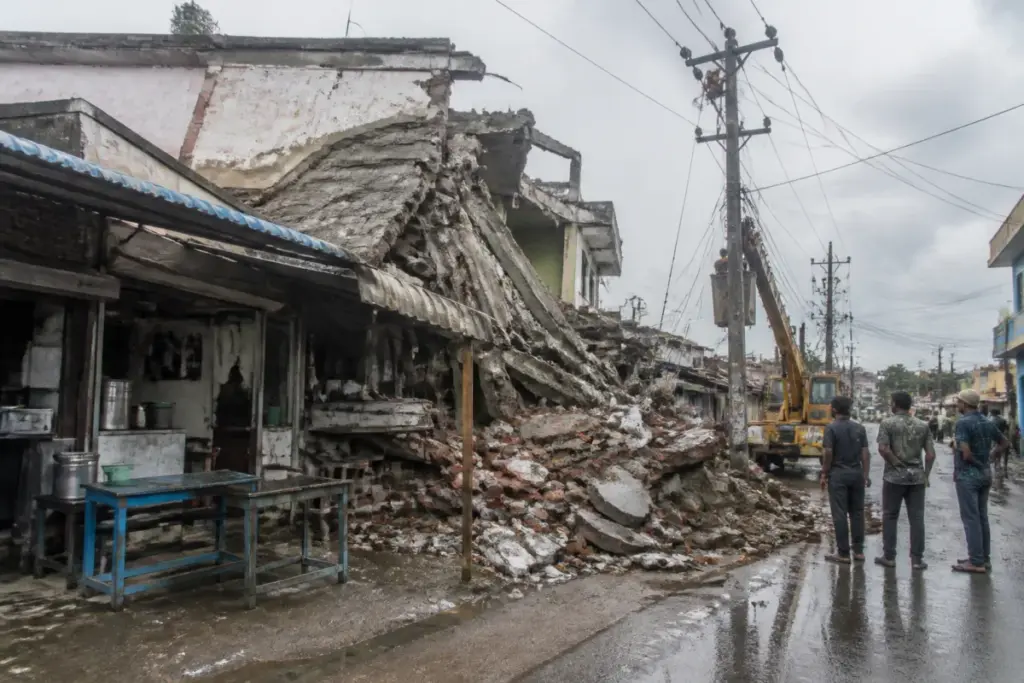 Debris from the Erode building collapse beside a damaged eatery in Karungalpalayam