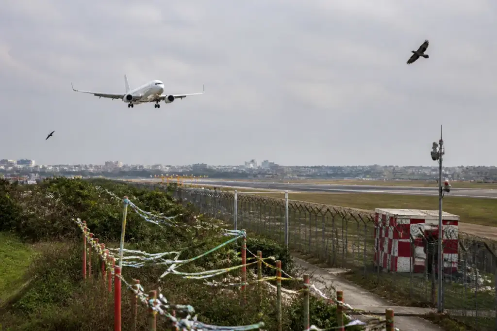 Patna airport runway area with bird-control ribbons installed to reduce bird hits