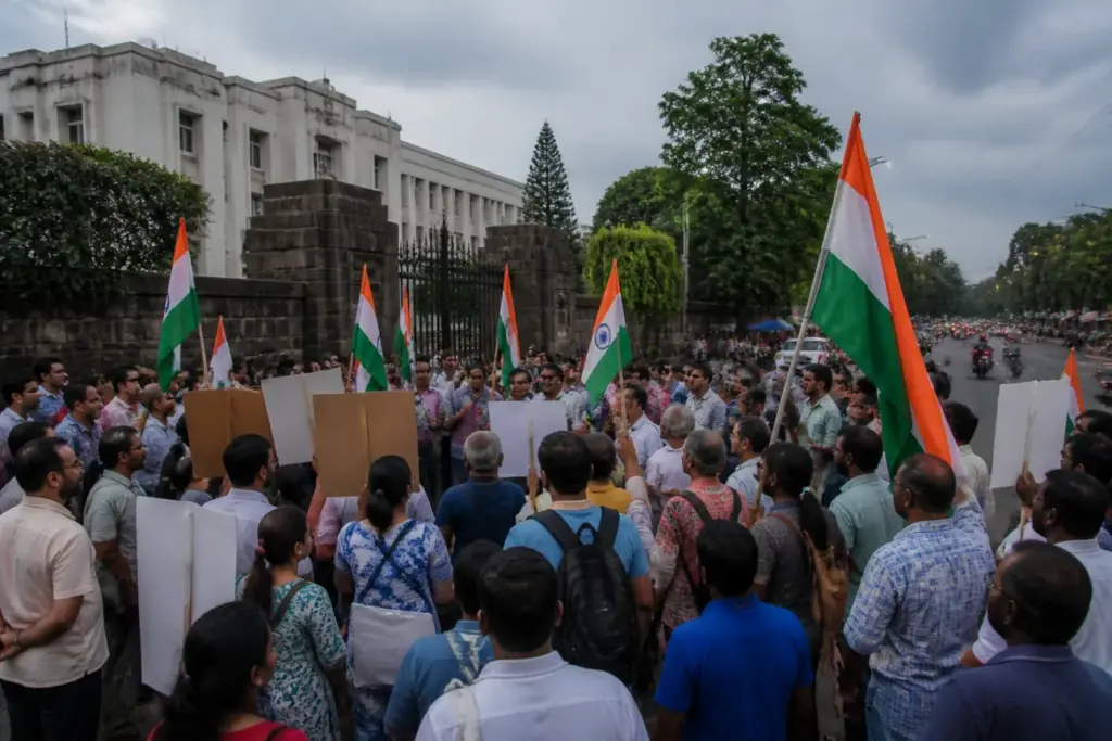 Pune protest near the Collector’s Office with demonstrators holding Tricolour-themed posters