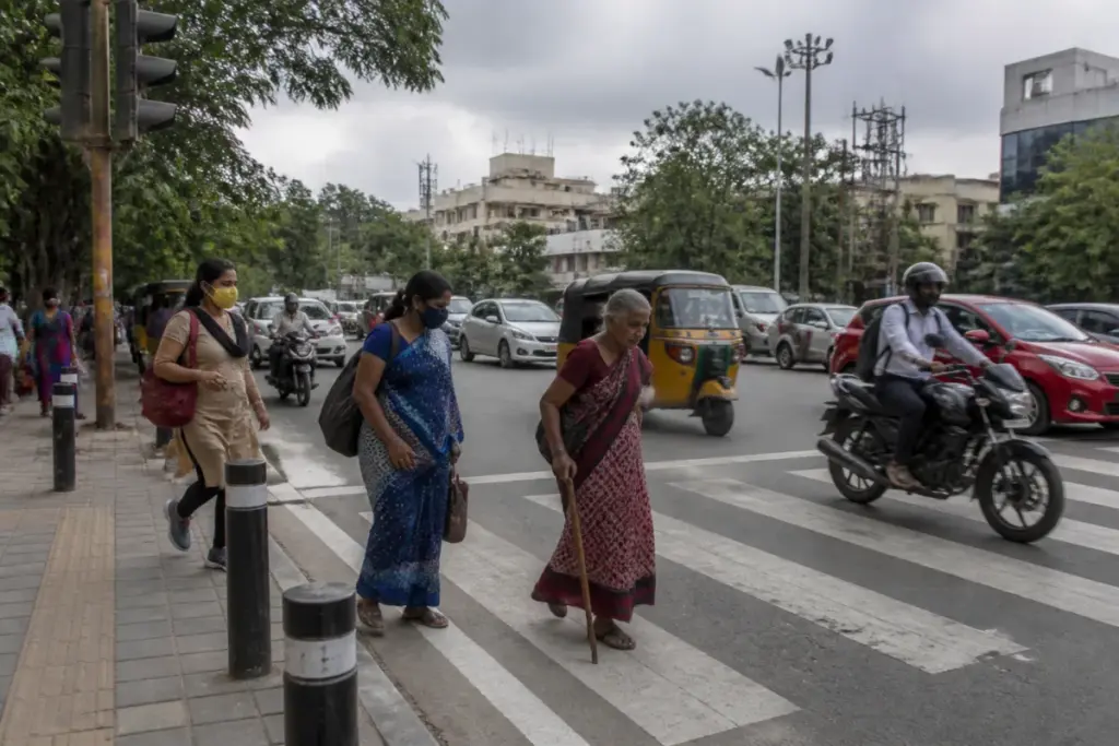 Telangana road deaths data highlights pedestrians crossing an urban road in Hyderabad