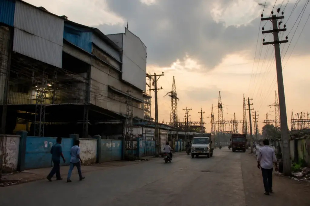 Surat power cut concerns at a textile industrial cluster with electricity infrastructure and factory buildings