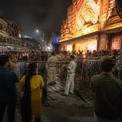 Kolkata pandal stampede aftermath near a Durga Puja venue with police barriers and emergency activity