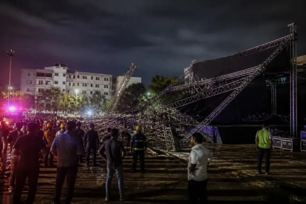Hyderabad college event accident scene with a collapsed metal lighting frame on an event ground