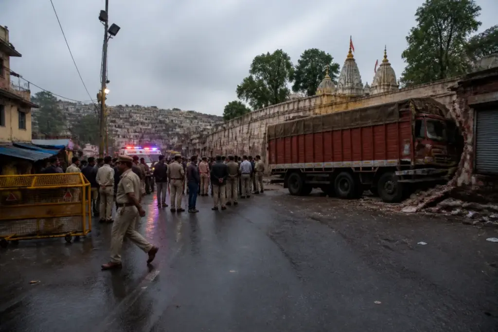 Police barricades and emergency vehicles near the Sheetla Mata Temple road after the Gwalior truck accident