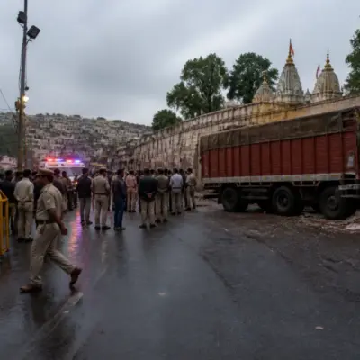 Police barricades and emergency vehicles near the Sheetla Mata Temple road after the Gwalior truck accident