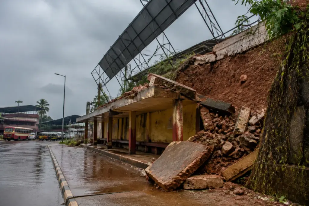 Collapsed BSNL compound wall beside the Uppinangady bus shelter after heavy rain