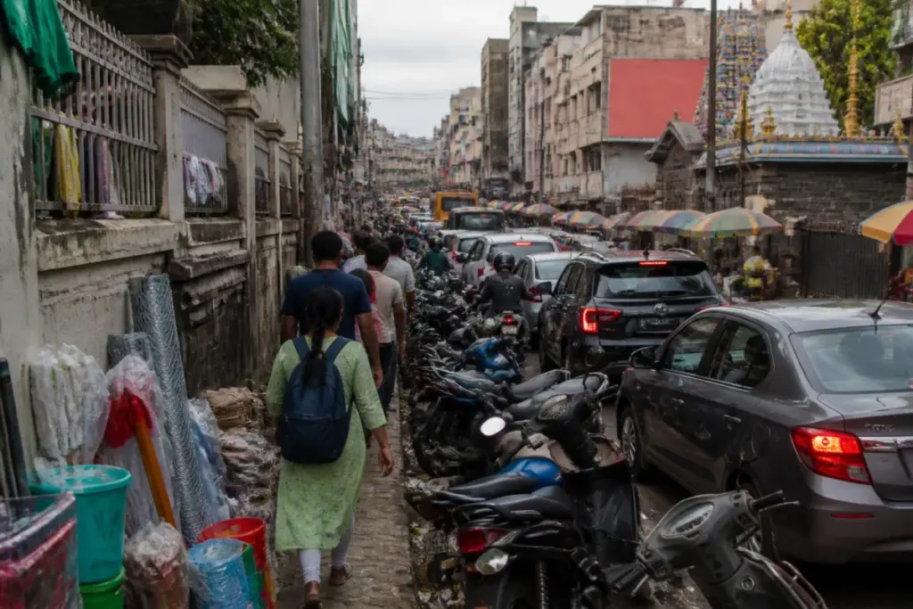 Shivajinagar footpath encroachments forcing pedestrians beside traffic in Bengaluru