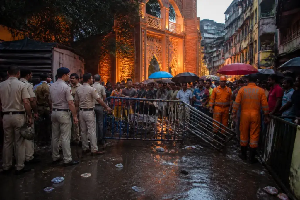 Kolkata Durga Puja stampede site at a crowded pandal exit after heavy rain