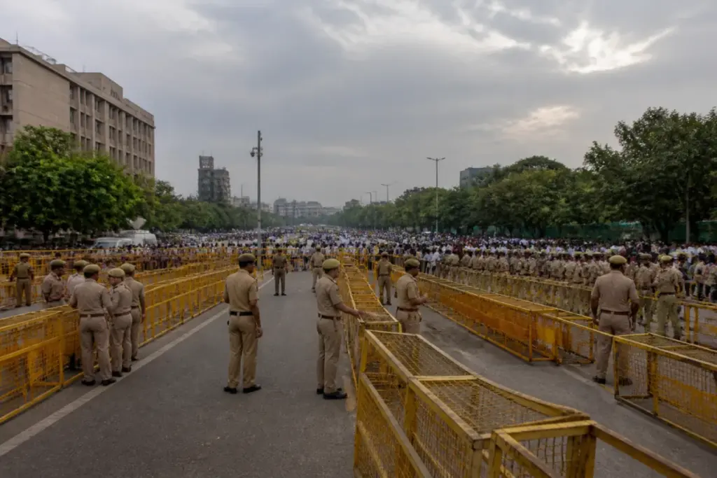 Delhi protest spaces with police barricades and a planned public assembly ground