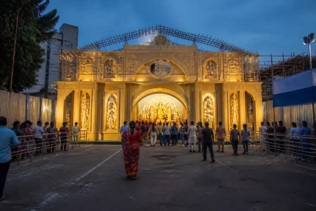 Durga Puja pandal safety measures at a widened entrance in Dhanbad