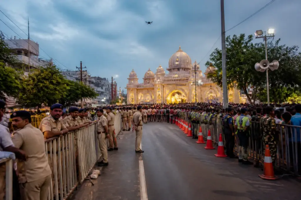 Ranchi Durga Puja security barricades and police managing crowds near a city pandal