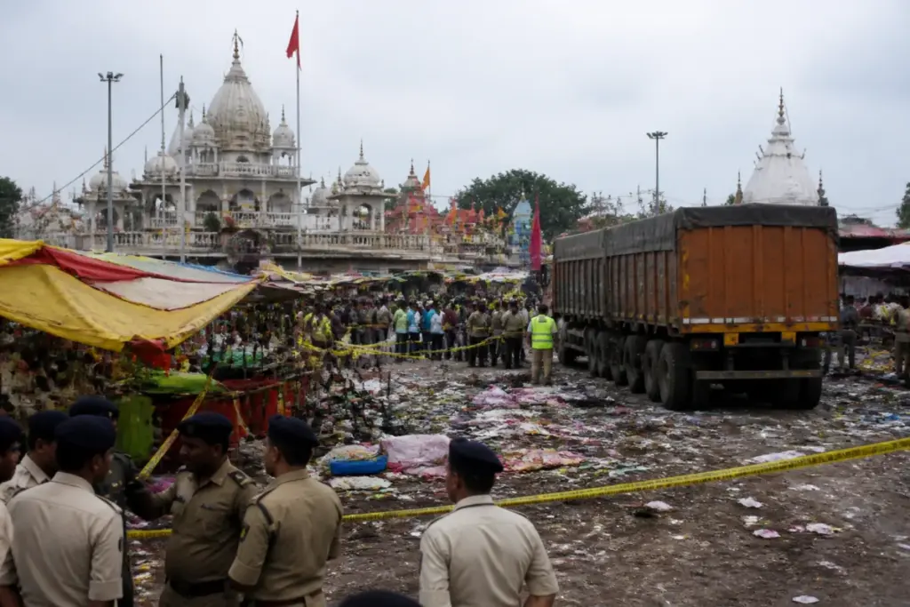 Gwalior temple tragedy scene near a crowded fairground with emergency response activity