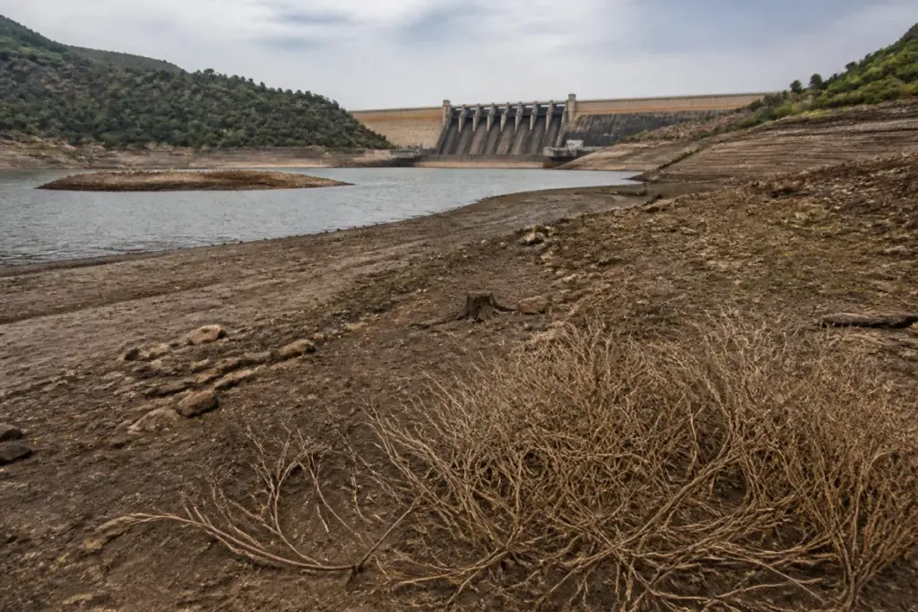 Karnataka water storage levels shown at a declining reservoir with exposed shoreline