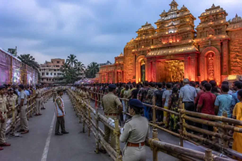 Durga Puja safety personnel managing devotees outside a crowded pandal in Bhubaneswar