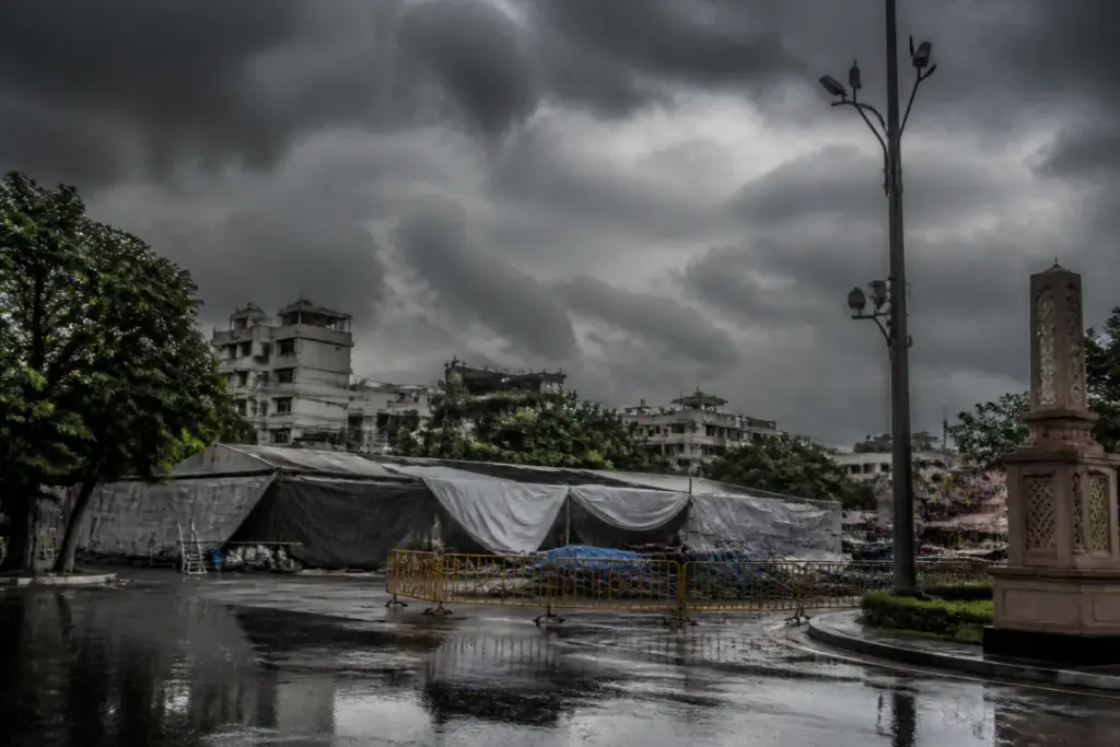 Indore rain clouds over city streets with waterlogged festival tents